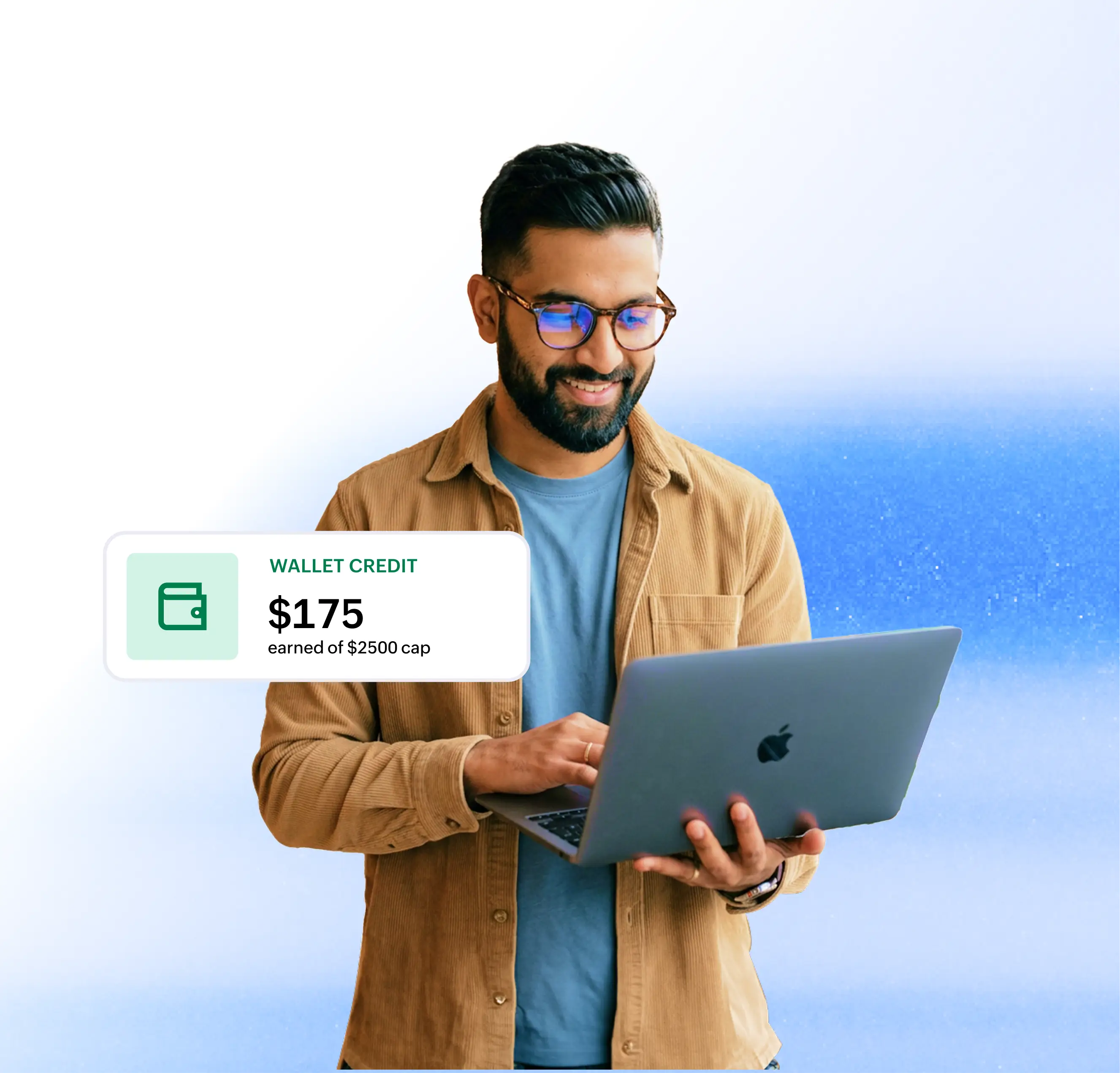 A business professional using a laptop, with a Zoho Wallet Credit notification showing $175 earned toward the $2500 cap